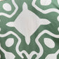 A close-up of the INIMIGO ISH3525 PALM SHIRT GREEN, featuring a green fabric with a symmetrical white pattern, reminiscent of a tropical print shirt.