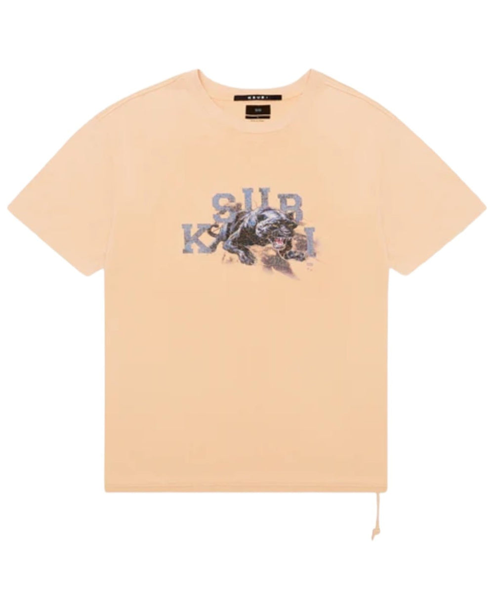 A beige KSUBI APEX BIGGIE SS TEE FLARE ORANGE with a graphic of a tiger and the text "SUP" and "KVL" printed on the front, featuring an oversized fit and crafted from premium cotton jersey.