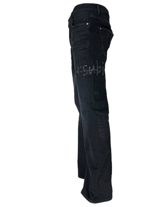 Side view of a pair of KSUBI BRONKO APEX 1999 BLACK bootcut jeans with visible stitching and a brand logo on the back pocket, crafted from comfort stretch denim.