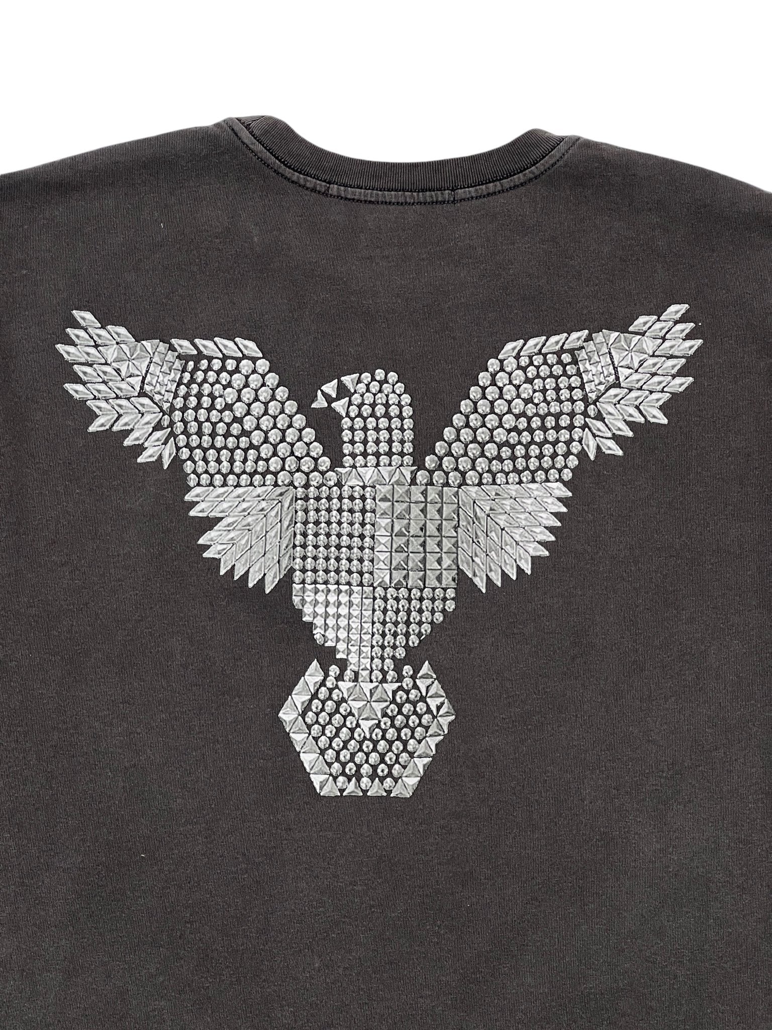 Explore the Ksubi Eagle Biggie SS Tee Faded Black by KSUBI, crafted from 100% cotton. This shirt boasts a striking silver eagle design of metallic studs on the back, combining style with comfort.