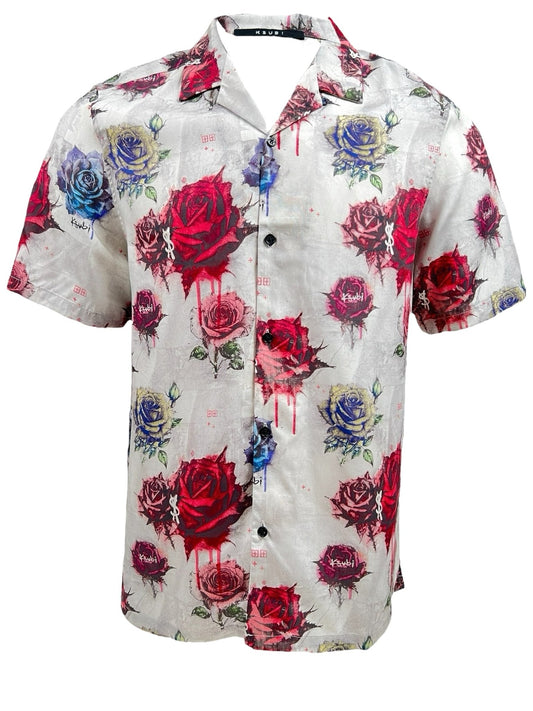 The KSUBI GRAFF ROSE RESORT SHIRT MULTI, crafted from soft Tencel, features a short-sleeved button-up design with a Ksubi rose print showcasing red, pink, blue, and purple roses on a light-colored background.