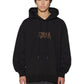 A person with straight dark hair wears the KSUBI Kingdom Biggie Hoodie in jet black, which has a small stylized chest logo, paired with dark pants and stands against a white background.