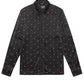 The Ksubi Polka Plus Ls Shirt Black by KSUBI is a sleek black long sleeve button-down with small white star patterns, crafted from high-quality polyester for a stylish, comfortable fit.