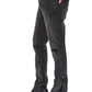 A person wearing KSUBI’s ksubi Van Winkle Torqued Chamber Black skinny jeans with zippered ankles, knee distressing, and black pointed-toe boots for premium comfort, stretch, and style.