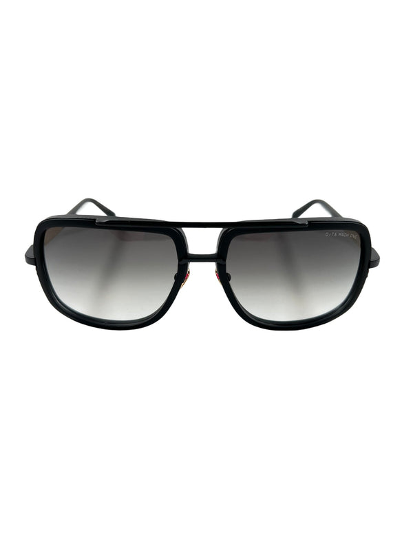 A pair of DITA MACH-ONE DRX-2030-G-BLK-18K-59 sunglasses with gradient lenses against a white background, exemplifying luxury eyewear.