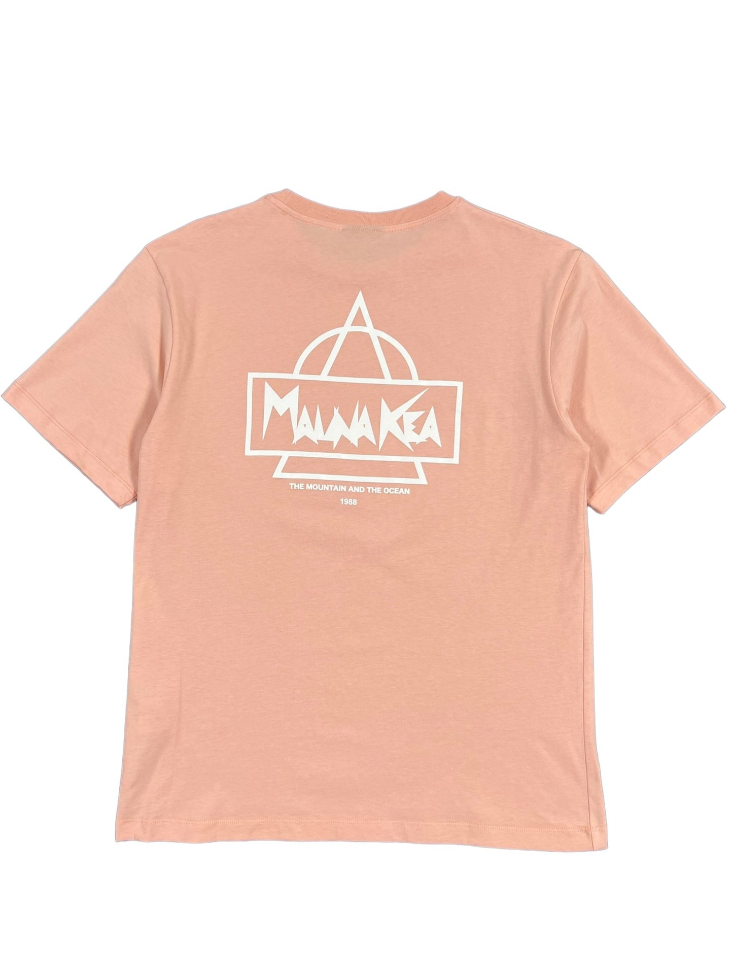 A pink, 100% cotton T-shirt features a white graphic on the back displaying the words "Mauna Kea" along with a triangle and semi-circle symbol. Below, it says "The Mountain and the Ocean 1963". This MAUNA-KEA MAUNA-KEA MKE100-04 HERITAGE TEE W SCREEN PRINT PINK blends comfort with style.