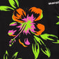 A vibrant graphic roses print with neon green and orange colors on a black fabric, featuring text "MAUNA-KEA" on top.