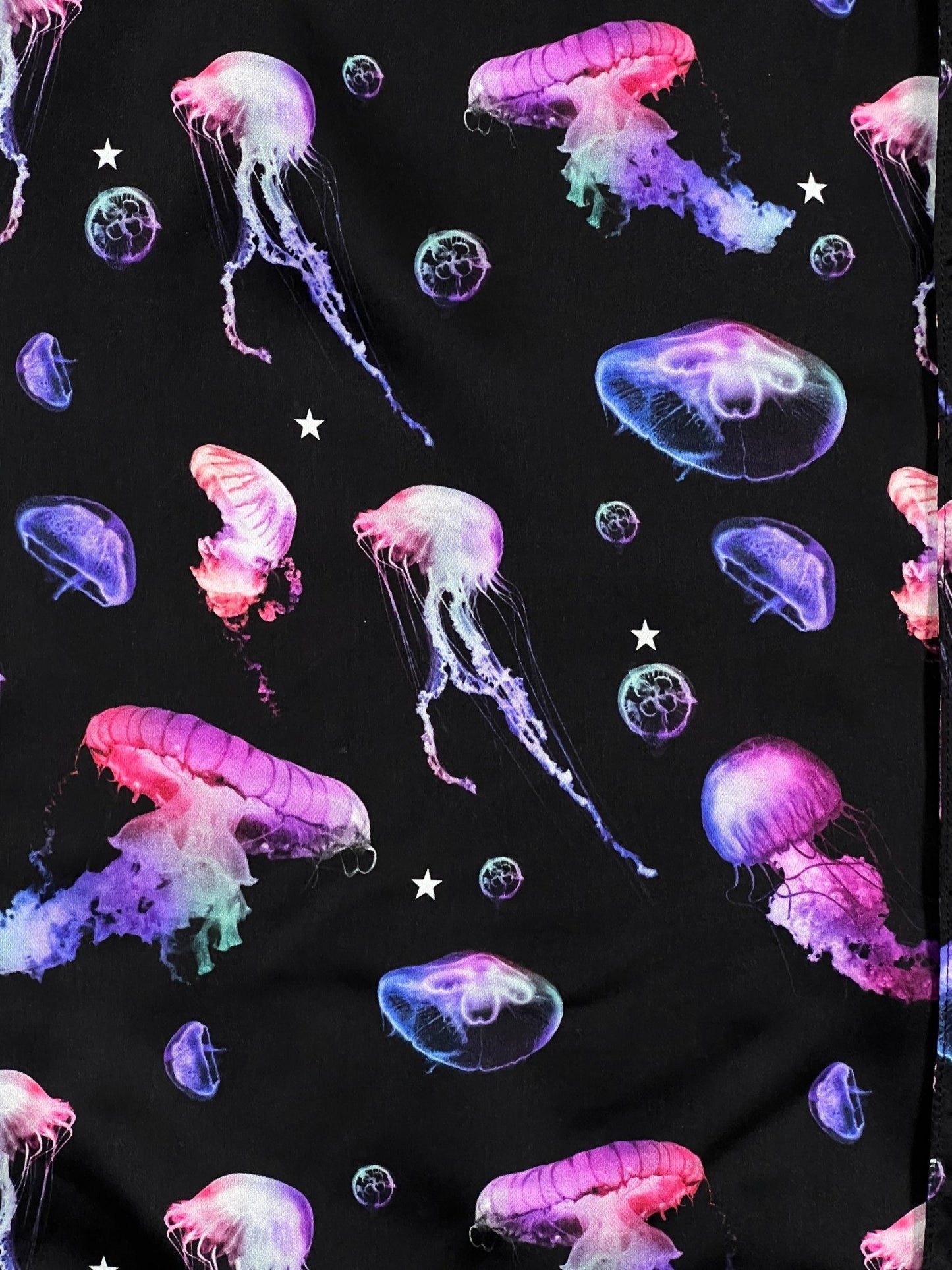 The Mauna-Kea Mku142-Jlf Allover Print Shirt by MAUNA-KEA has a striking design with colorful jellyfish and small stars on a black background, offering an ideal graphic print shirt made in Italy.