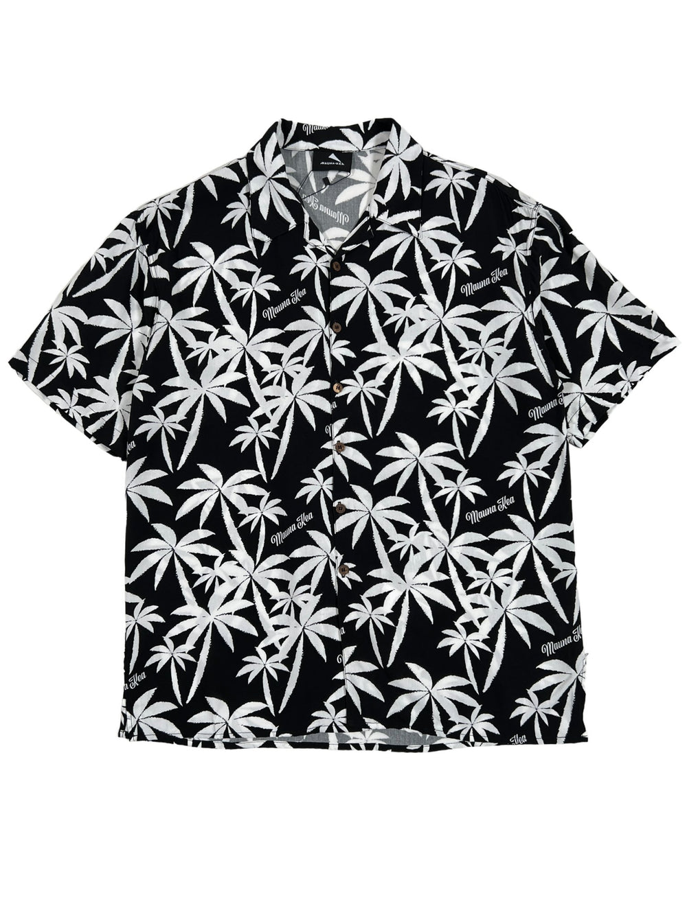 The Mauna-Kea Mku142-Pm1 Allover Print Shirt in black, from the brand MAUNA-KEA, features a chic white palm leaf pattern and embodies the spirit of tropical getaways. This short-sleeve button-up shirt is expertly designed to elevate your casual style with its graphic allure.