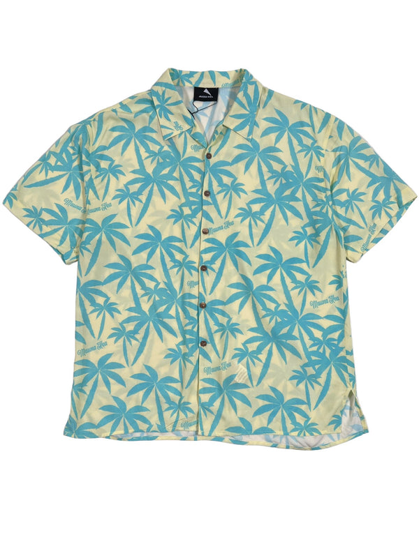 A MAUNA-KEA MKU142-PM2 ALLOVER PRINT SHIRT GRN with a light yellow background and blue palm tree pattern, featuring a unique Mauna-Kea graphic. Made in Italy, this short sleeve shirt combines style and quality for a standout look.