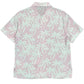The Mauna-Kea Mku142-Pm3 Allover Print Shirt by MAUNA-KEA showcases graphic palm trees in light pink and green set against a pastel background, evoking the tranquil vistas of Mauna Kea.