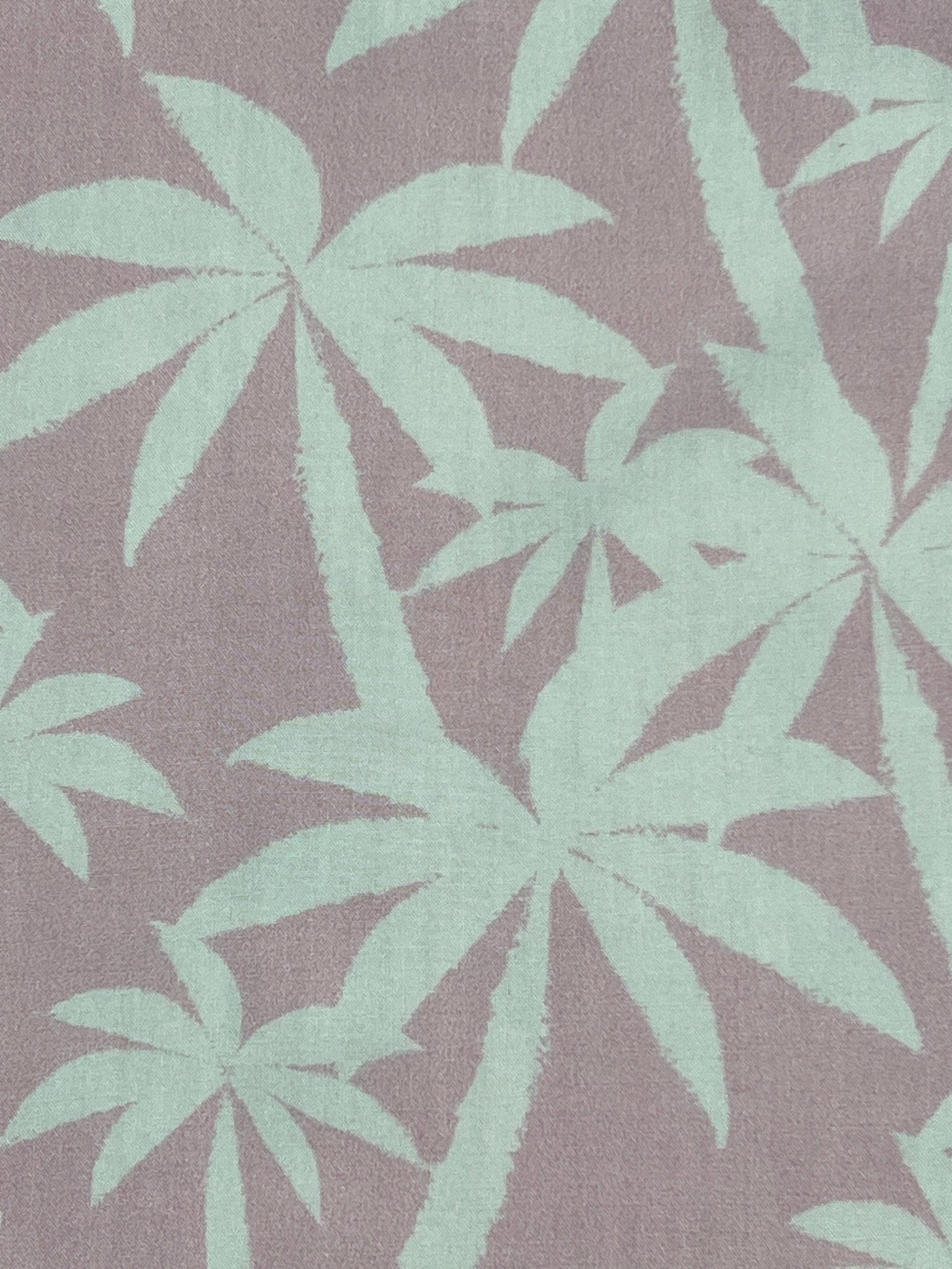 The Mauna-Kea Mku142-Pm3 Allover Print Shirt by MAUNA-KEA features a pattern of light green palm leaves set against a gray background, echoing the lush beauty of Mauna Kea.