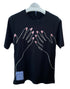 Display of a Mcq By Mcqueen 647244Rst87 T-Shirt in darkest black featuring a two-hand illustration with pink nails. A small tag subtly adorns the embroidered graphic design, enhancing the visual appeal on the hanger. Brand: MCQ BY MCQUEEN.