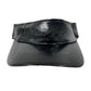 The Mcq By Mcqueen 692287Rgc96 Handsy Visor Black by MCQ BY MCQUEEN is a black leather cap with "VIGOR" embossed on the front, featuring a shiny finish and stitched detailing.