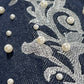 Close-up of pearl embroidery and silver stitching on the Only The Blind BC25SSPT22 Raw Pearl Flared Jeans Blue by BIRTH OF ROYAL CHILD.