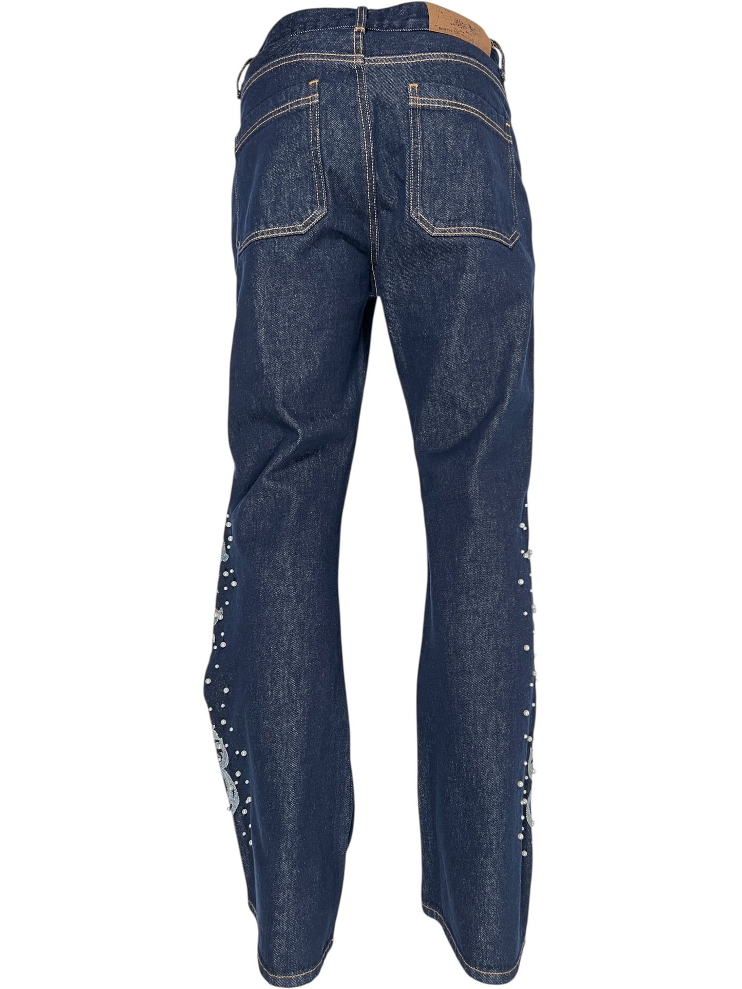 Back view of BIRTH OF ROYAL CHILD Only The Blind BC25SSPT22 Raw Pearl Flared Jeans in blue raw denim, featuring contrast stitching and decorative elements along the outer side seams.