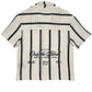 The Only The Blind OTB-SH1520 Desert Stripe Crochet Shirt, featuring beige and black stripes and back text details, showcases the unique style of ONLY THE BLIND.