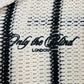The Only The Blind OTB-SH1520 Desert Stripe Crochet Shirt showcases beige and black stripes with "Only The Blind LONDON" embroidered, offering a chic and modern look.