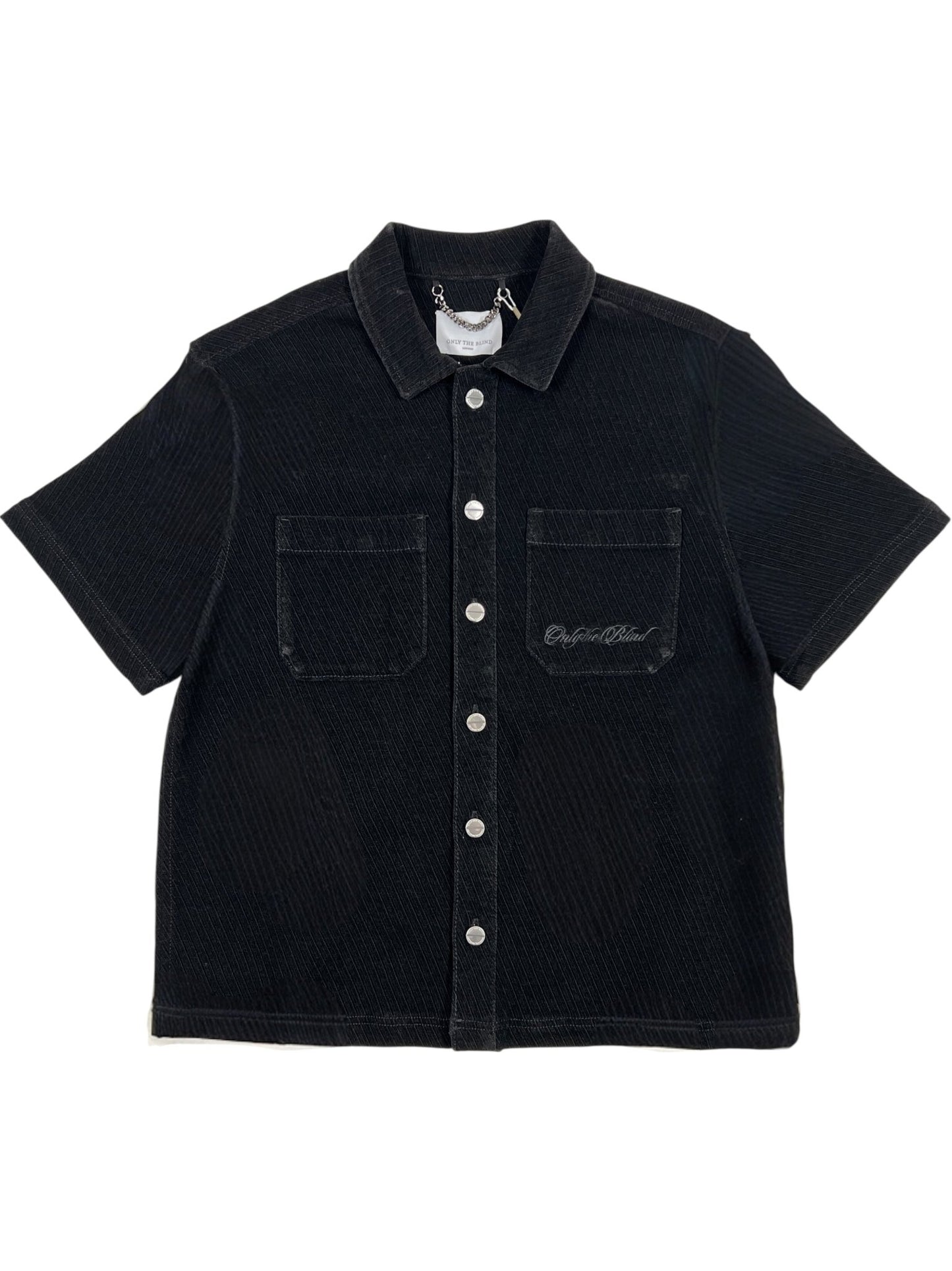 The Probus Only The Blind OTB-SH1572 Noir Heritage Shirt Black features short sleeves, two chest pockets, a collar, and a small embroidered script on the left pocket.