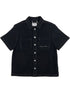 The Probus Only The Blind OTB-SH1572 Noir Heritage Shirt Black features short sleeves, two chest pockets, a collar, and a small embroidered script on the left pocket.
