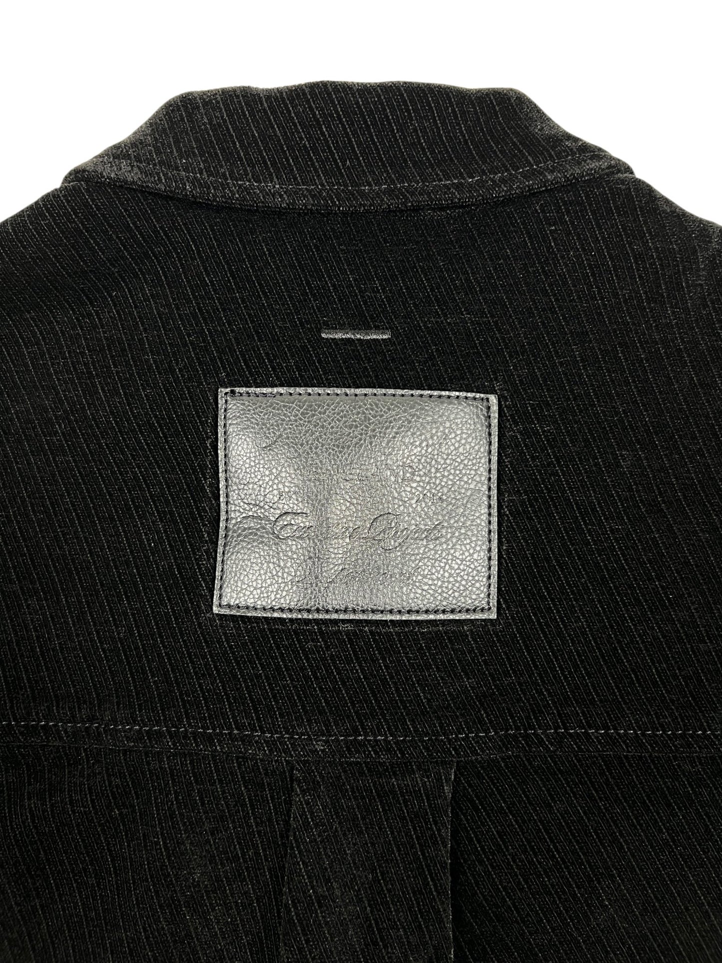Close-up of the upper back of the Probus Only The Blind OTB-SH1572 Noir Heritage Shirt Black, showing black pinstripes and a rectangular gray leather patch with faint embossed writing.
