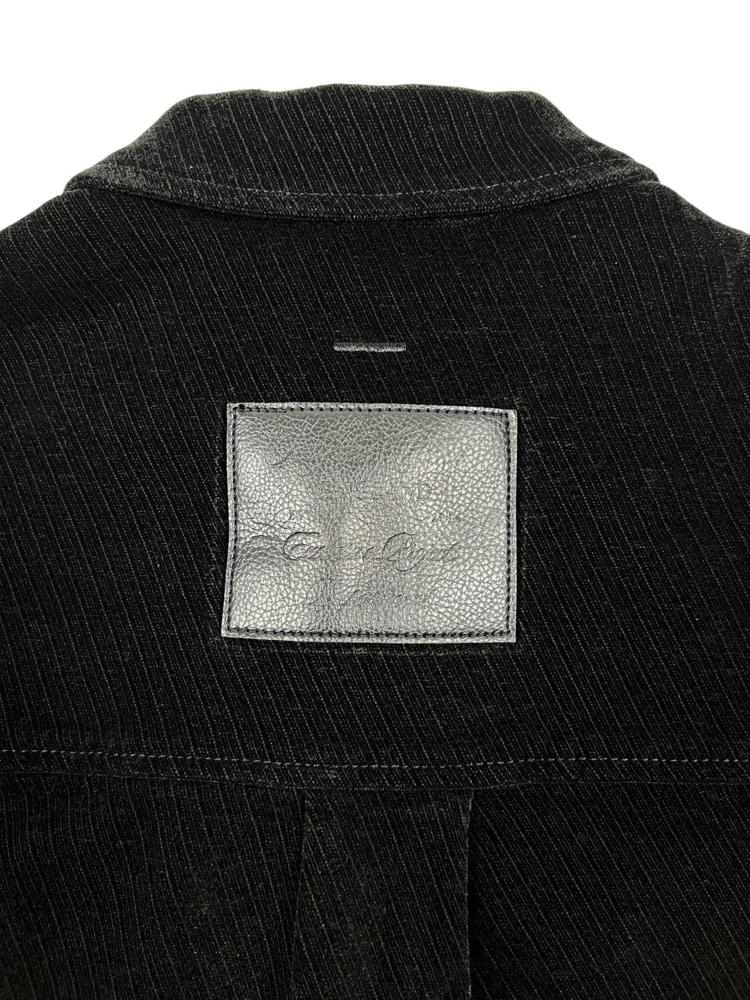 Close-up of the upper back of the Probus Only The Blind OTB-SH1572 Noir Heritage Shirt Black, showing black pinstripes and a rectangular gray leather patch with faint embossed writing.