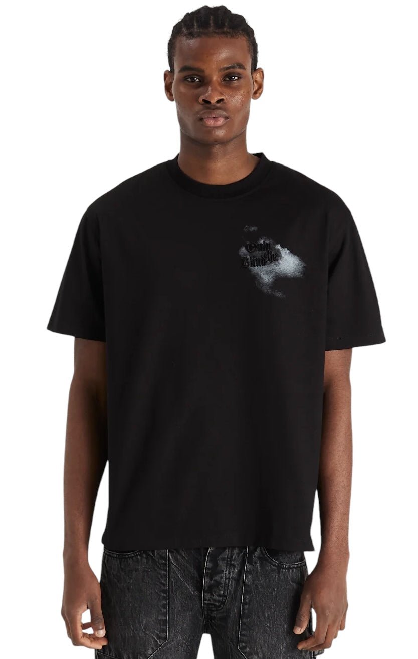 A person wearing the Only The Blind OTB-T1357 Midnight Hawk T-shirt Black, featuring a small design on the left side, stands against a white background. Part of ONLY THE BLIND's WILDWOOD collection, this shirt is crafted from organic cotton for ultimate comfort and style.