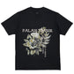 The Only The Blind OTB-T1472 Botanical T-shirt in black features an embroidered floral design and "Palais Napsir" & "De La Liberte" text on the back, crafted from soft organic cotton for superior comfort.
