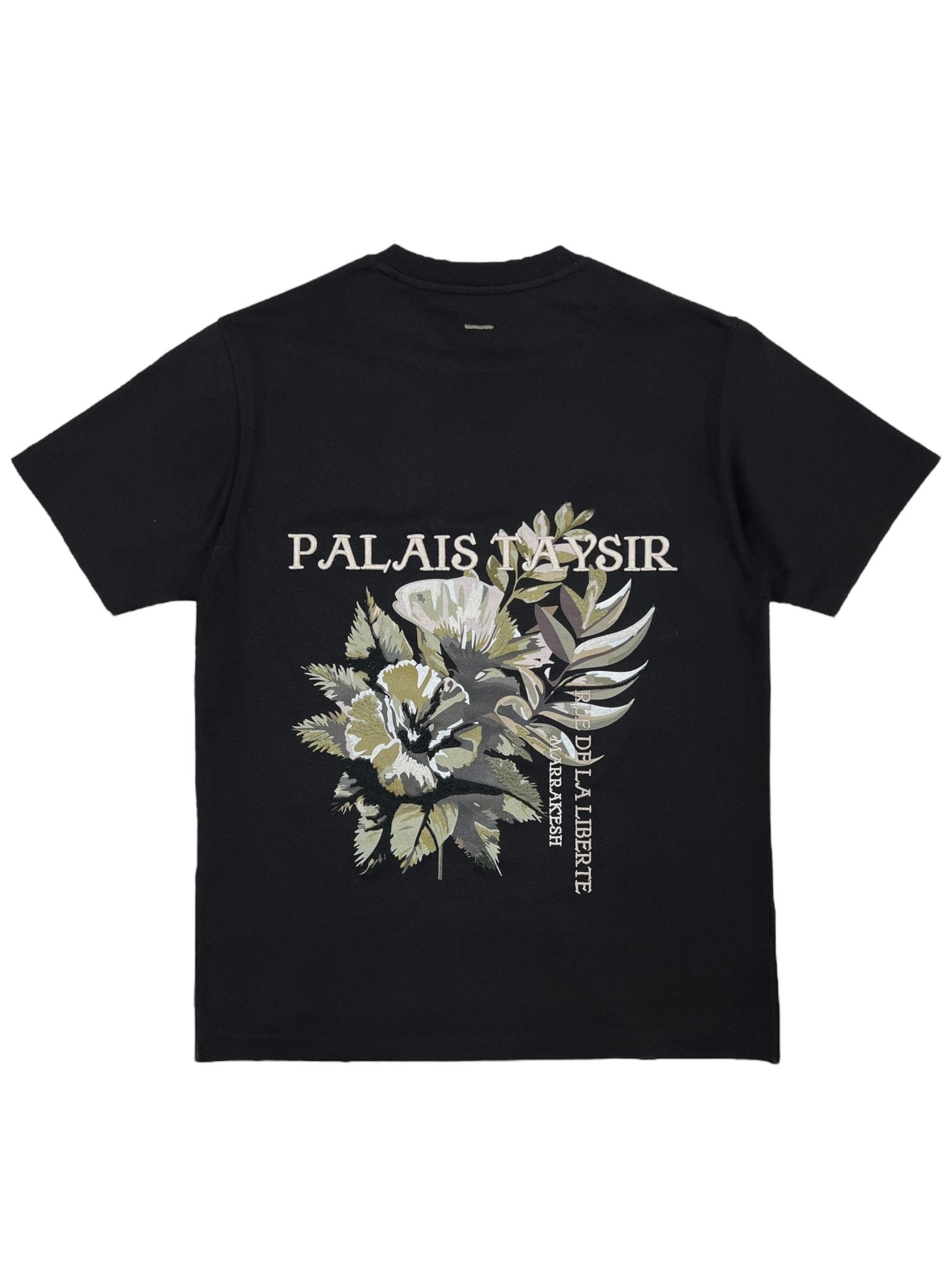 The Only The Blind OTB-T1472 Botanical T-shirt in black features an embroidered floral design and "Palais Napsir" & "De La Liberte" text on the back, crafted from soft organic cotton for superior comfort.