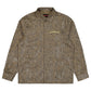 The PLEASURES Anaconda Overshirt Brw features a brown snakeskin-patterned design, long sleeves, and a small yellow embroidered logo on the chest, subtly echoing anaconda allure.