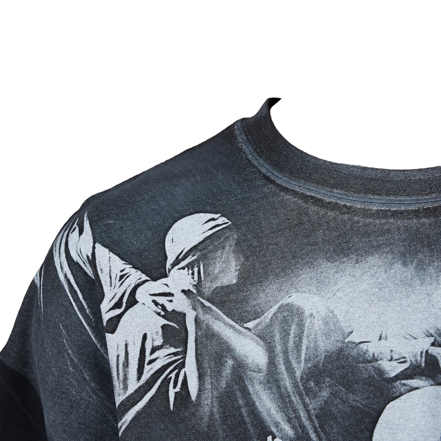 Close-up of a PLEASURES cotton jersey t-shirt with a monochrome classical art print on a white background, featuring an oversized plastisol print in an official collaboration with Joy Division.