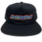 PLEASURES BAKED LOGO SNAPBACK BLACK hat made from polyester and nylon featuring "Half Baked" embroidered on the front in blue, yellow, and red letters.