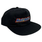 PLEASURES BAKED LOGO SNAPBACK BLACK hat, featuring "Half Baked" embroidered in colorful letters on the front, made from a durable blend of Polyester & Nylon.