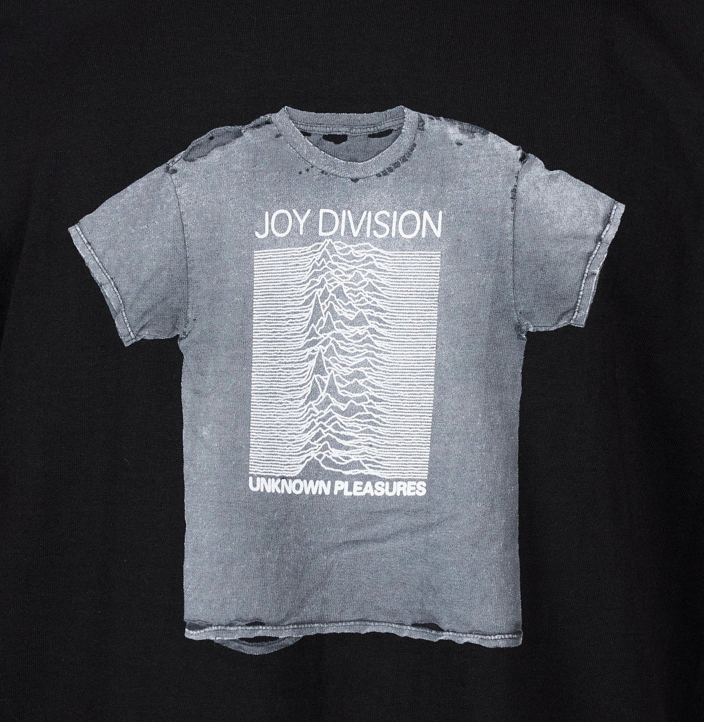 Gray official PLEASURES "Unknown Pleasures" album cotton screen-printed t-shirt on a black background.