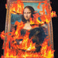 A captivating design of the Mona Lisa engulfed in vibrant flames is featured on the Pleasures Burn Again Hoodie Black by PLEASURES, creating an illusion of a tapestry of fire.