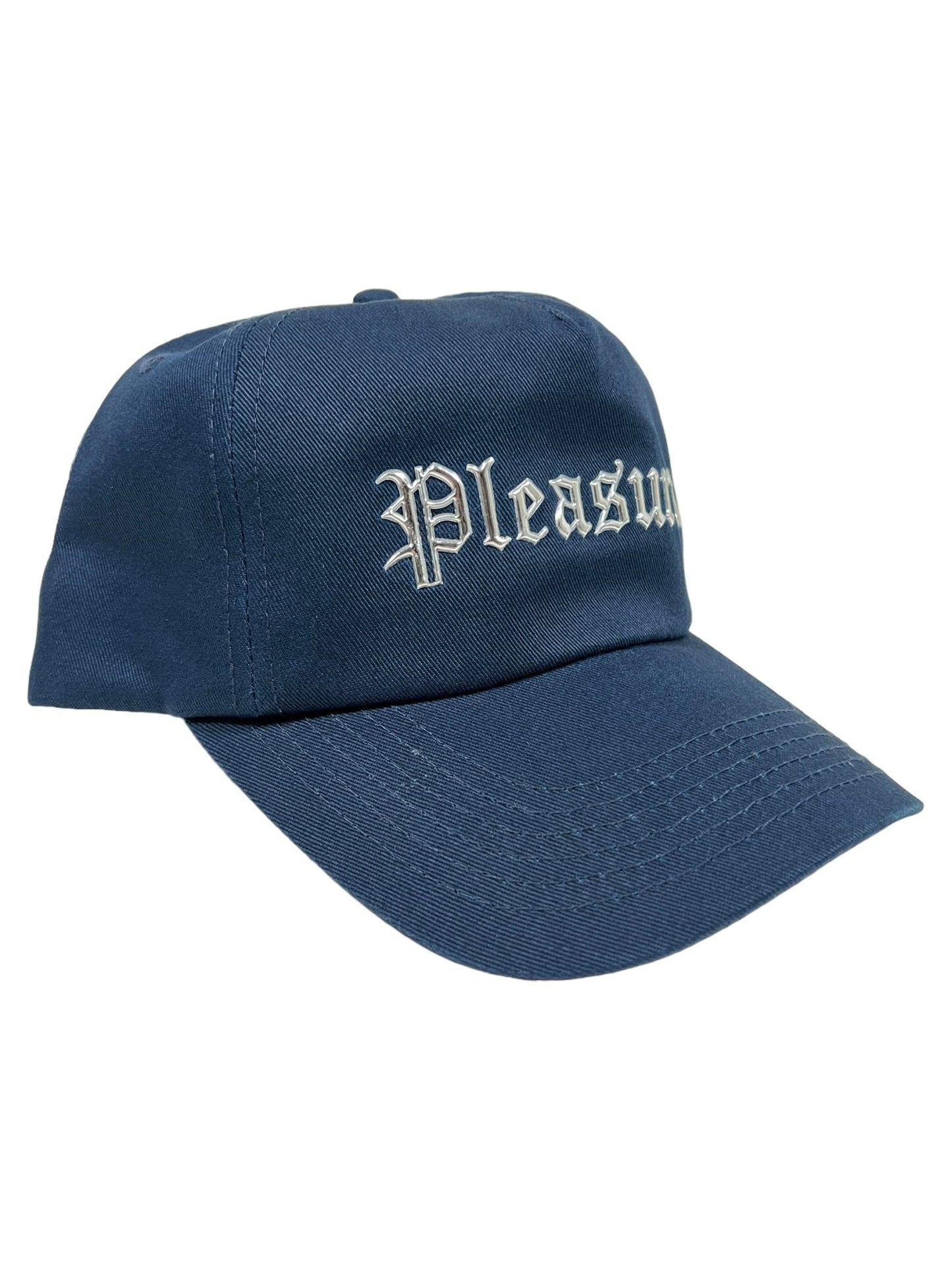 A PLEASURES CHROME SNAPBACK NAVY, this navy blue baseball cap from the brand PLEASURES features the word "Pleasures" embroidered in white Gothic-style letters on the front. Made from a blend of polyester and nylon, it offers both style and durability.