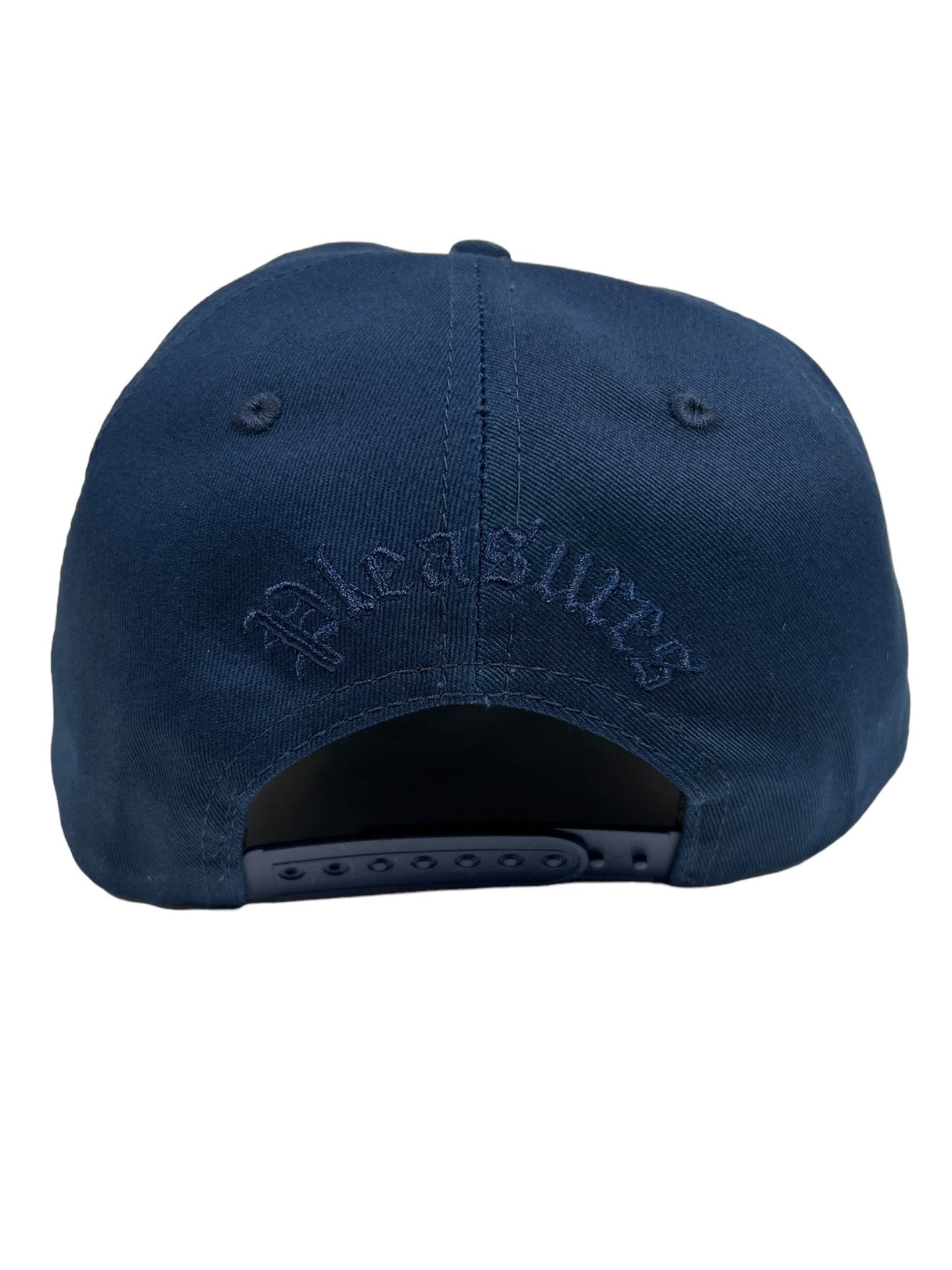 Back view of the PLEASURES CHROME SNAPBACK NAVY hat by PLEASURES, featuring an adjustable strap, crafted from Polyester and Nylon, with the word "Pleasures" embroidered above the opening.