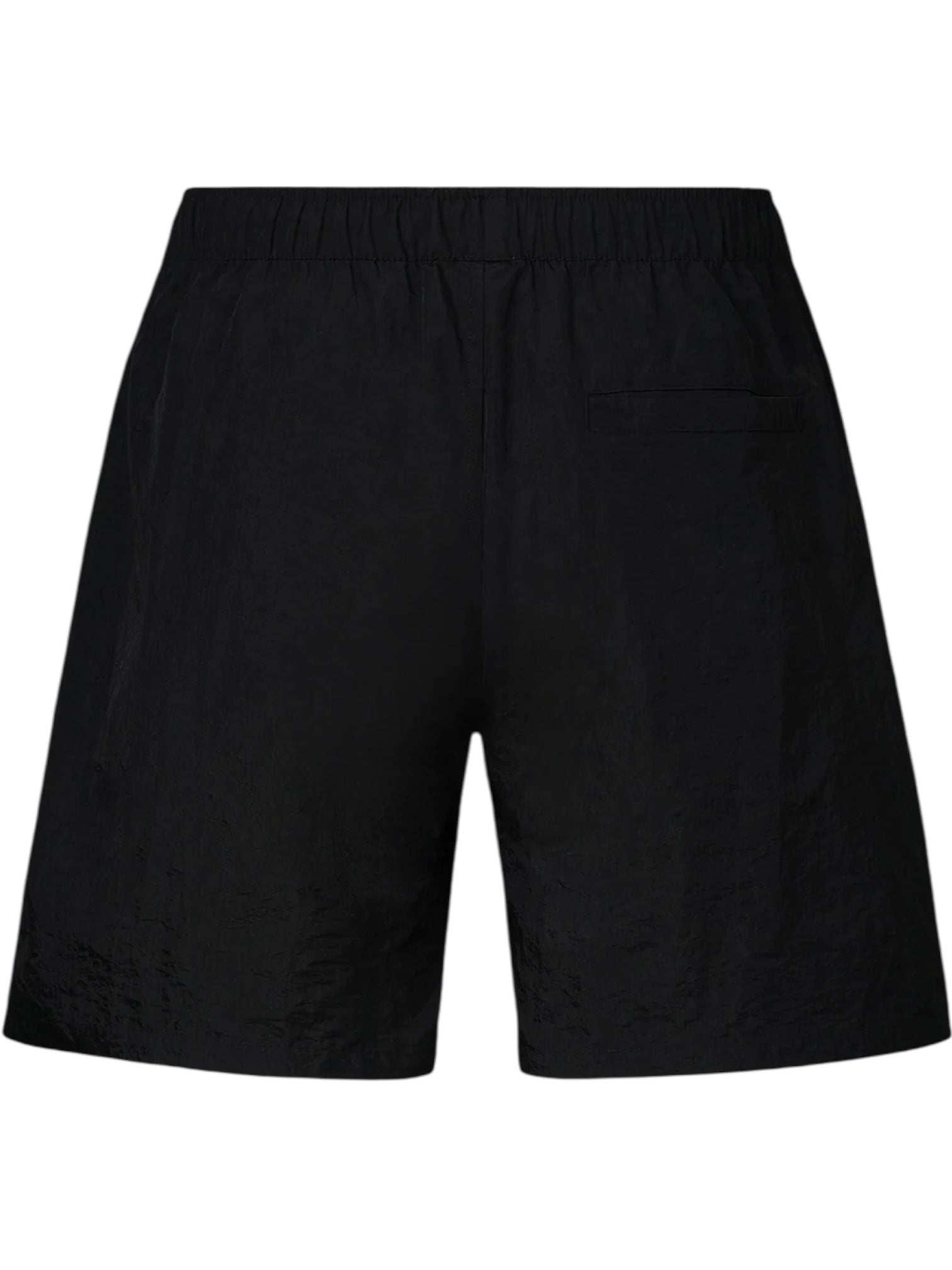 The PLEASURES Crush Hiking Shorts Black feature a plain nylon design with an elasticized waistband and a single back pocket, shown here from the back.