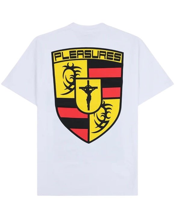 The Pleasures Fast Life T-shirt in white by PLEASURES is made from soft cotton and features a bold shield graphic in yellow, red, and black with a crucifix detail and "PLEASURES" at the top on the back. Made in the USA.