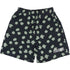 The Pleasures Floral Seersucker Shorts Black by PLEASURES feature black cotton seersucker fabric, light green clover print, and a white "PLEASURES" logo embroidered on the left leg.