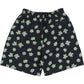 The Pleasures Floral Seersucker Shorts Black by PLEASURES feature black cotton seersucker fabric, an elastic waistband, green and white floral pattern, a single buttoned back pocket, and an embroidered logo.
