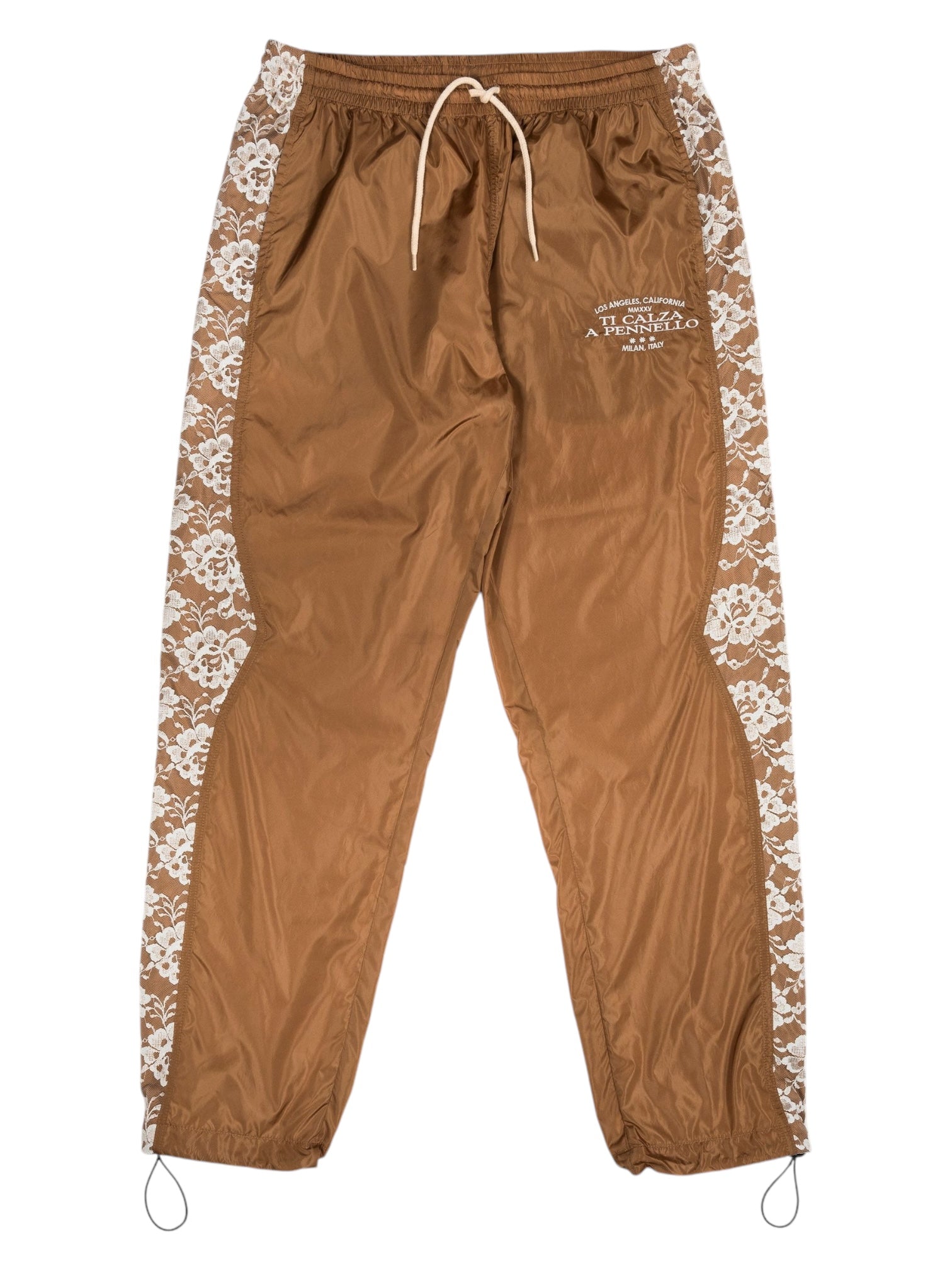 The PLEASURES Francesca Track Pants feature a drawstring waistband, a brown design with white floral side stripes, and text on the left thigh. Expertly crafted in Italy from durable polyamide for both style and comfort.
