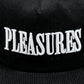 The PLEASURES ONYX CORDUROY SNAPBACK ONYX is a sleek black corduroy hat featuring the word "PLEASURES" embroidered in bold white capital letters.