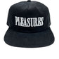 The PLEASURES ONYX CORDUROY SNAPBACK ONYX is a black corduroy hat featuring "PLEASURES" embroidered in large white letters on the front. It has a front panel with a flat, wide brim.