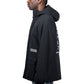 Man in profile wearing a Pleasures Run Hooded Jacket in Black from PLEASURES, featuring graphic text on the back and sleeve, crafted from 100% nylon, paired with plaid pants.