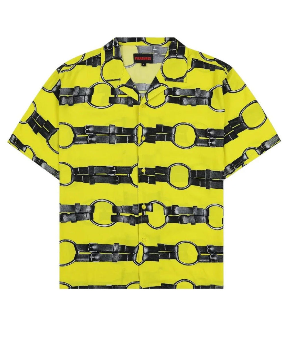 The PLEASURES STRAPS BUTTON DOWN YELL by PLEASURES is a short-sleeve button-up shirt with a yellow background and a black belt pattern, featuring vintage 2-hole buttons.