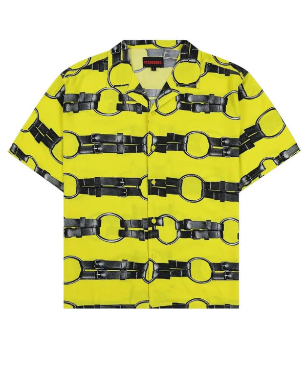 The PLEASURES STRAPS BUTTON DOWN YELL by PLEASURES is a short-sleeve button-up shirt with a yellow background and a black belt pattern, featuring vintage 2-hole buttons.