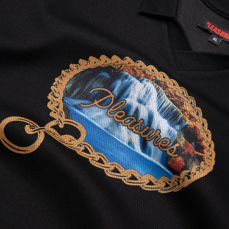 The Pleasures Submission Boxy Polo Black by PLEASURES is a twill knit polo featuring a waterfall print bordered by rope and "Pleasures" in cursive across the graphic.