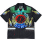 The PLEASURES Time Bowling Button Up Black is a polyester short-sleeve shirt with a clock at 12:00, neon "TIME TO BOWL" text, and bowling pins on black—a classic look from PLEASURES.