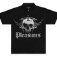 The Pleasures Tradition Polo Shirt Black by PLEASURES is made from 100% cotton and showcases a bold skull with thorns graphic plus “Pleasures” in striking gothic font on the front.